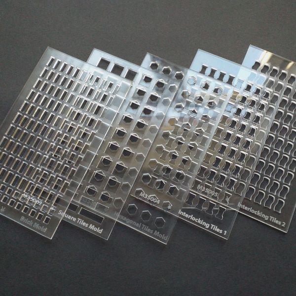 <p>This special offer comprises all 5 of our acrylic brick- and tilemolds for airdrying clay:<br />
<br />
*M35001 Brick Mold<br />
*M35002 Square Tile Mold<br />
*M35003 Hexagonal Tiles Mold<br />
*M35004 Interlocking "Dogbone" Tile Mold<br />
and *M35005 Interlocking "Wave" Tile Mold -<br />
<br />
for €65,00 (if bought separately, 5 x 15 = €75,00, so: €10,00 off).<br />
<br />
To use a mold, stretch paper tape across its backside, lay it on a flat and surface, place a ball of airdrying clay upon it, and work it into the cavities.<br />
Do NOT use plaster, putty or resin. These are impossible to remove from the mold once dry. You need the minimal shrinkage of airdrying clay.<br />
<br />
Drag/scrape a straight and firm plastic spatula (or the edge of another mold) across the surface, skimming off the surplus material. Leave to dry, remove the paper tape, then push out the individual bricks using a blunt stick (like the reverse end of a brush).<br />
<br />
Warning: do NOT bend the mold. It is acrylate, not silicon. You will break it.<br />
<br />
To get rid of any sharp edges - and make your bricks look more realistic - rub small amounts of them together gently between the palms of your hands, softening their edges.<br />
<br />
You can colour your clay/putty by working in pigments before pressing it into the mold, or paint it after drying.</p>
